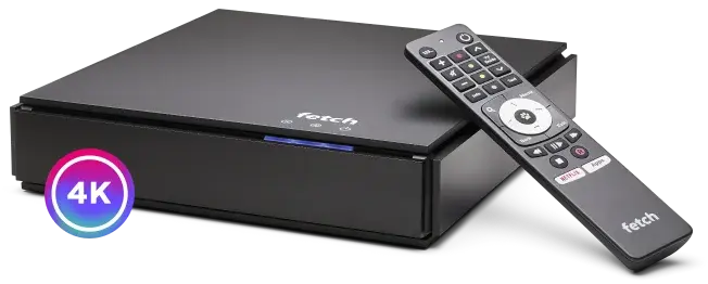 A black Fetch Mighty set-top box with its remote control